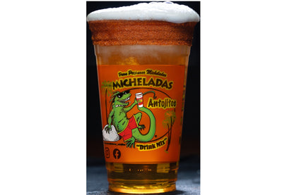 Caliente Michelada Cup with dark beer poured over ice